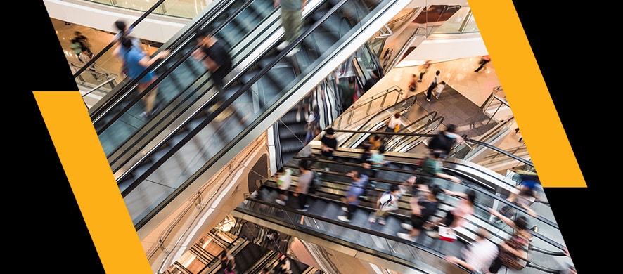 crowds on mall escalators